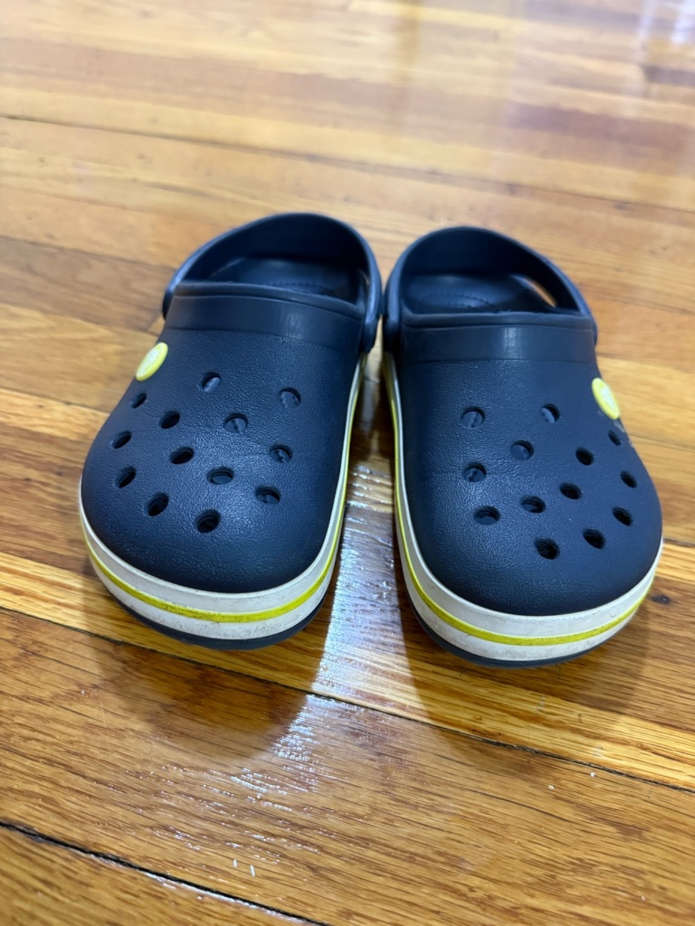 CROCS Kids Black Clogs with Yellow Trim
